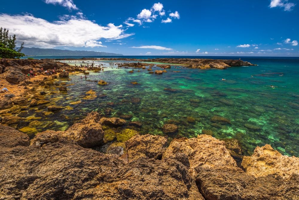 Scenic view of Sharks Cove, Hawaii, a small rocky bay side of Pupukea Beach Park
