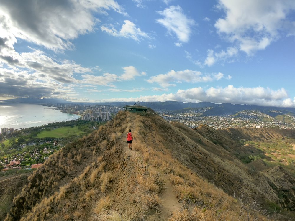 A woman walks up Diamond Head in Honolulu Hawaii