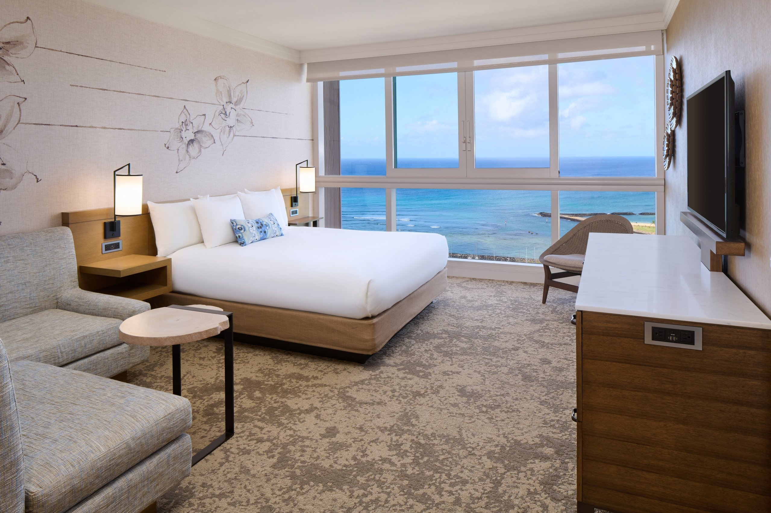 Oceanfront Suite in Prince Waikiki with ocean views from the floor-to-ceiling windows.
