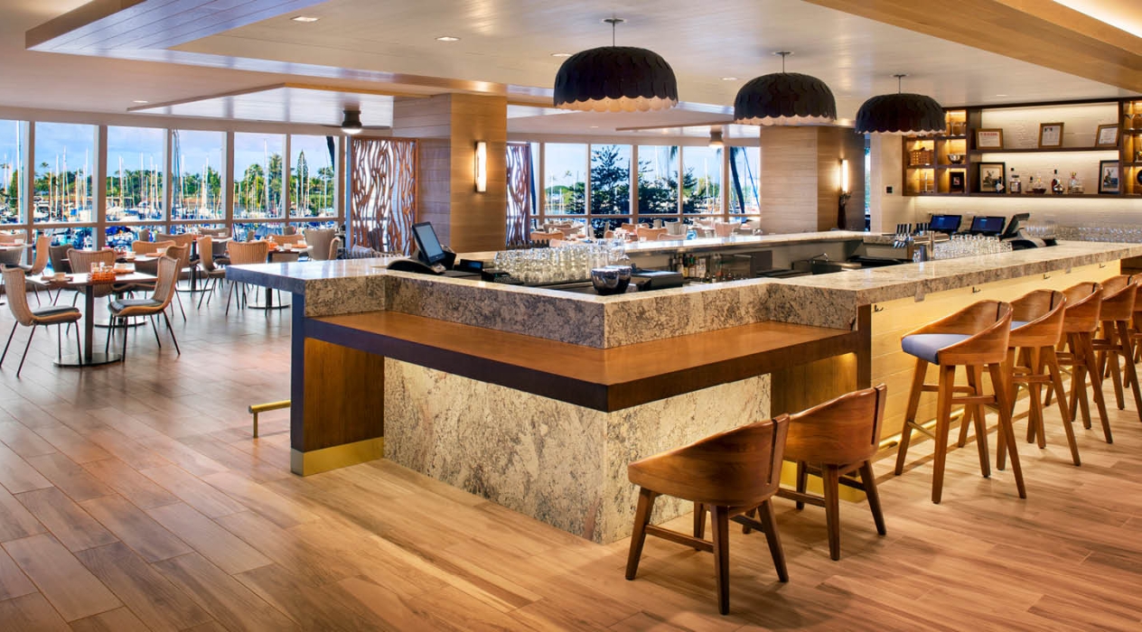 The bar at the 100 Sails Restaurant & Bar with views of the ocean yacht harbor from 100 Sails Restaurant & Bar in the Prince Waikiki hotel.