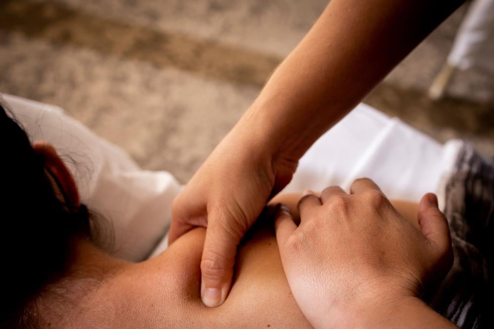 Close up of a woman receiving a massage at Naio Bliss in the Prince Waikiki hotel.