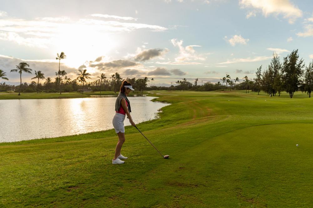 A woman plays golf at Hawaii Prince Golf Club in Honolulu, Hawaii.