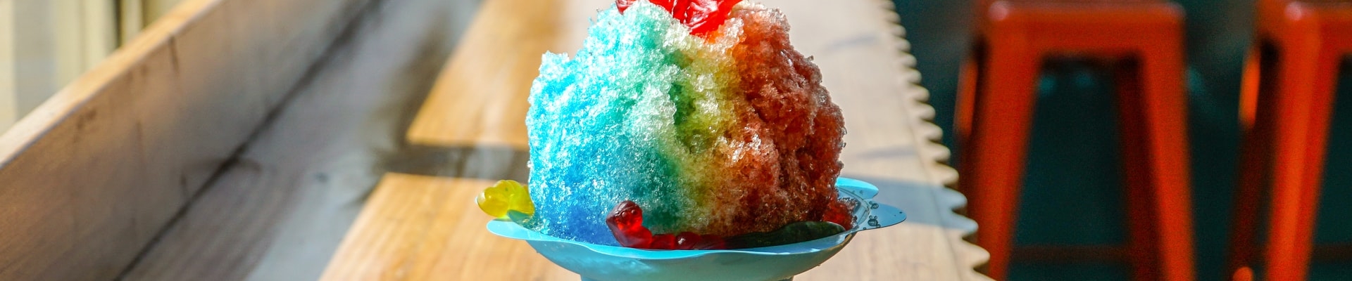 Shave ice on a table with gummy bears in Honolulu, Hawaii.