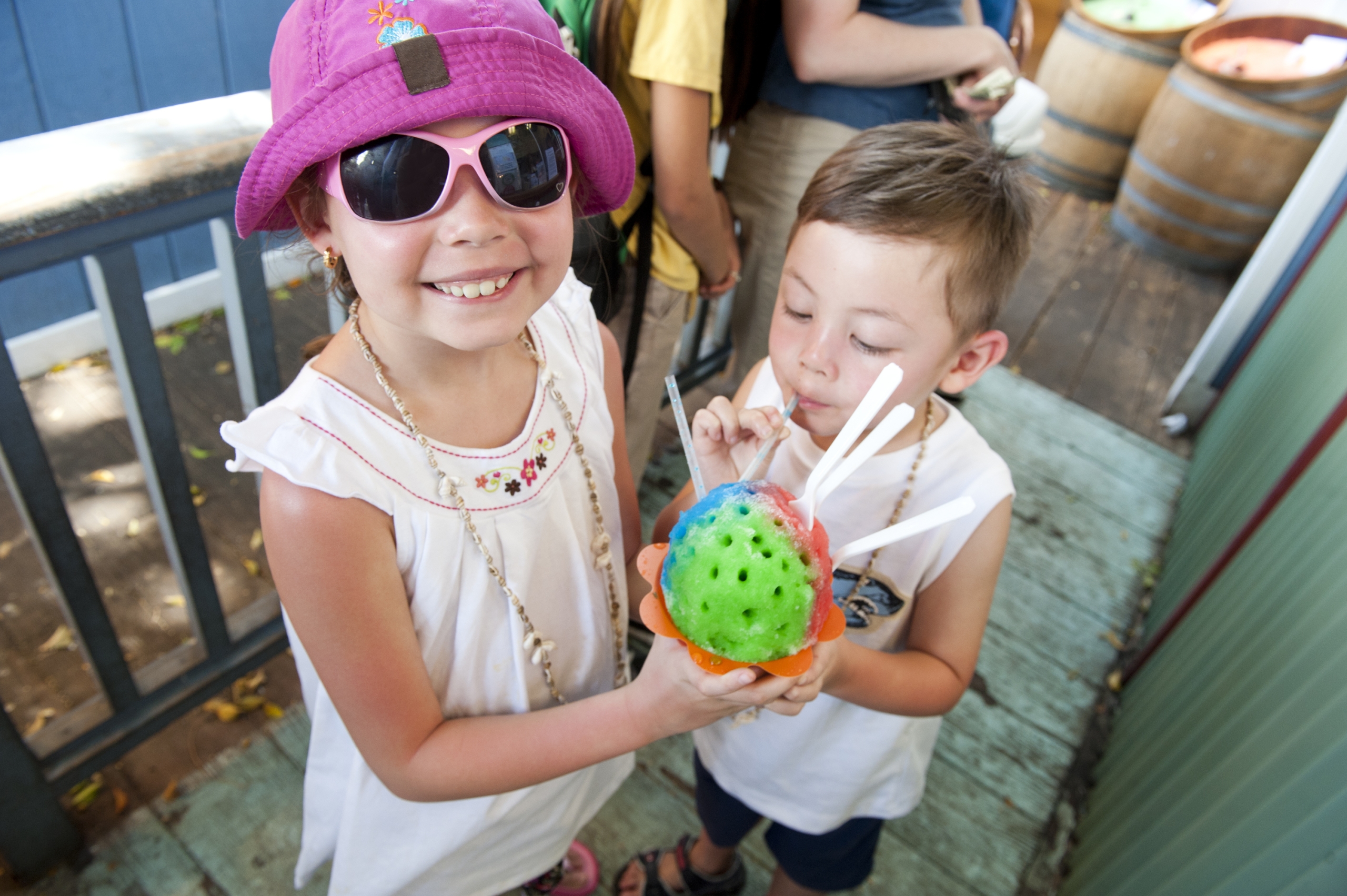 Two children share an order of shave ice