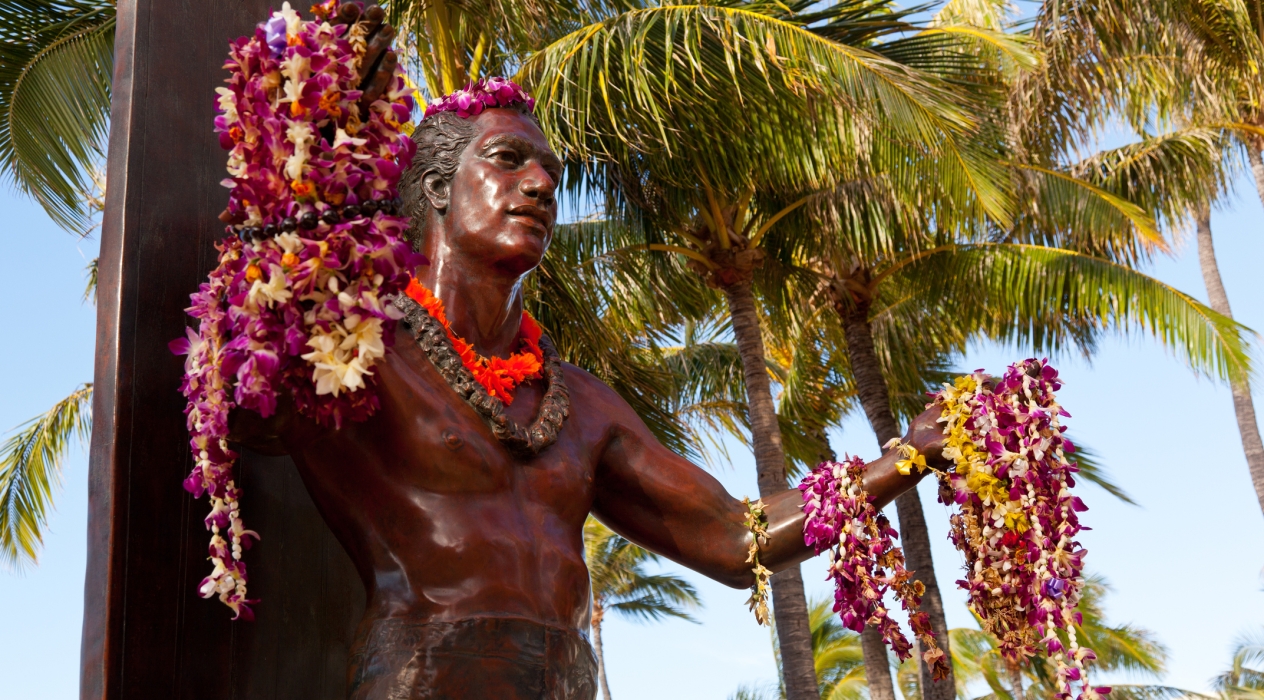 Statue of famous surfer Duke Kahanamoku on Waikiki beach in Hawaii